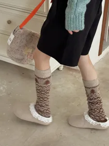 Cozy Fair Isle knit leg warmers for women, thick winter slouchy thermal socks for cold weather.