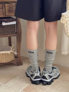 Grey ribbed cotton calf socks with stylish letter label, perfect for casual daily wear.