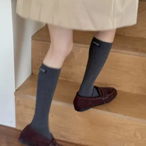 Korean style ribbed calf socks for women, comfortable solid color cotton tube socks.