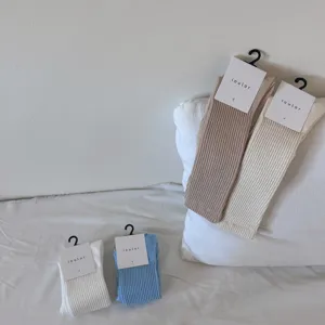 Detailed view of Japanese style solid color ribbed slouch socks, comfortable combed cotton fabric.