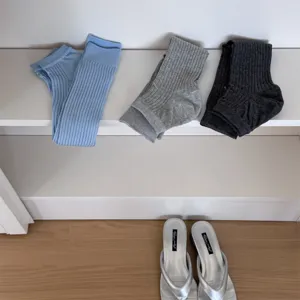 Solid color ribbed stirrup socks set, casual stacked leg warmers for daily wear and trendy outfits.