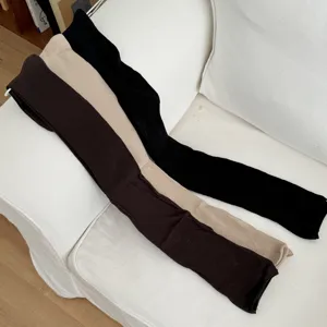 Solid color ribbed long socks detail shot, soft knit over-the-knee stockings for women.