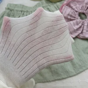 White ribbed pantyhose fabric texture and stretch detail view showing elasticity