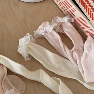 Detailed shot of sweet lace trim ruffle socks, breathable thin summer hosiery, soft pastel.