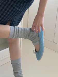 Comfortable grey ribbed leg warmers and stylish blue flats for casual daily outfits wear.