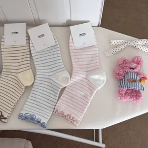 Sweet ruffed striped cotton mid-calf socks for women, breathable spring and summer casual wear.