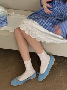 Detail view of sweet style women striped mid-calf socks, soft cotton fabric for daily wear.