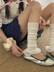 White lace slouch socks detail shot, sweet JK style leg warmers for spring and summer.