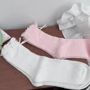 Cute ruffle bow polka dot mid-calf socks for women, soft cotton casual hosiery for daily wear.