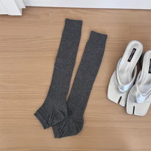 Dark grey ribbed stirrup socks, Korean style stacked leg warmers for casual wear.