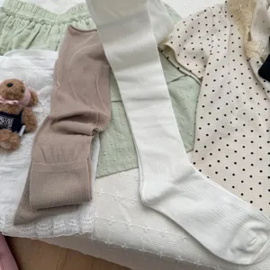Cozy ribbed over-the-knee socks for women, cute Japanese style solid color long knit socks.