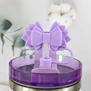 Silicone bow straw cover for Stanley cup, cute purple dust plug tumbler accessory.