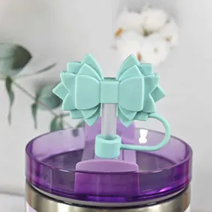 Silicone bow straw cover for Stanley tumbler, cute mint green dust plug accessory.