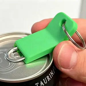 Detail view of the green plastic can opener pull tab tool with metal keyring for easy opening.