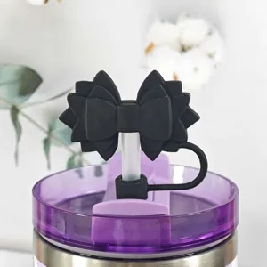 Silicone black bow straw topper dust plug accessory detail for Stanley tumbler cups.