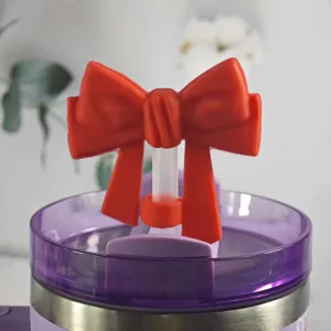 Cute red silicone bow straw topper dust plug accessory for tumbler cups detail view