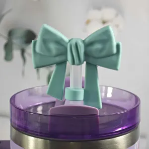 Silicone bow straw topper detail shot, cute dust plug cover for tumbler and cups.