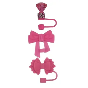 Silicone straw cover set featuring pink diamond and bow designs for tumbler cups.