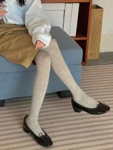 Grey ribbed pantyhose detail, soft cotton blend material, stylish spring and summer wear.