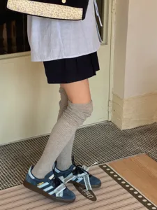 Detailed view of women's grey over-the-knee stacked socks, Japanese style casual knee high socks.