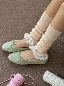 Japanese style sweet lace ruffle leg warmers and flat ballet shoes detail shot for women.