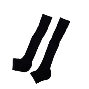 Black stirrup leg warmers for women, ribbed knit over-the-knee socks, trendy fashion style.