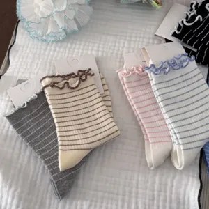 Sweet striped mid-calf socks with cute lettuce edge ruffles for women, comfortable daily wear.