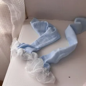 Detail view of light blue Japanese style lace ruffle leg warmers socks for women JK outfit