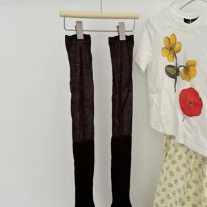Black over-the-knee long socks for women, stylish solid color ribbed anti-slip hosiery.