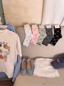 IOULOR cute bow mid tube socks for women, sweet rolled edge cotton casual socks for daily wear.