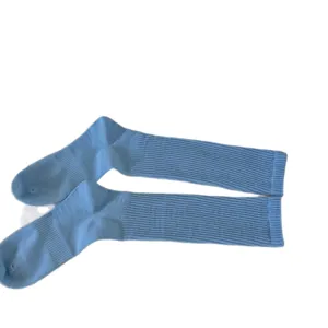 Light blue ribbed long socks for women, solid color cotton stacking socks for daily wear.