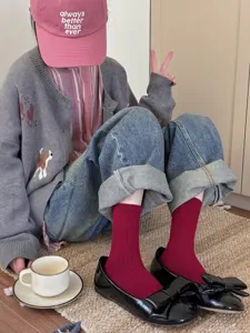 Detail view of solid color mid-calf socks styled with daily outfit, soft and comfortable.