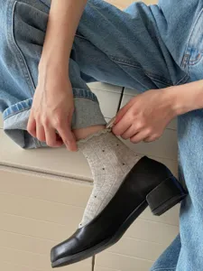 Detailed view of women's sweet polka dot lace short socks, breathable knitted daily wear style.