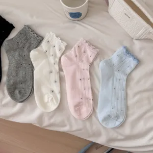 Detail view of sweet polka dot ruffle ankle socks, breathable thin fabric for women summer.