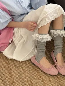 Comfortable grey footless slouch socks with delicate white lace trim for stylish daily wear