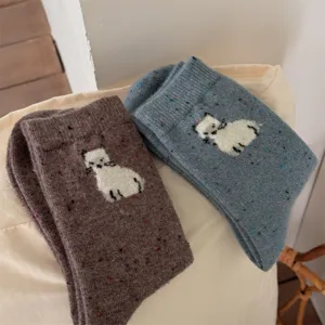 Cozy wool knit socks with cute animal pattern and colorful specks, perfect for autumn and winter.