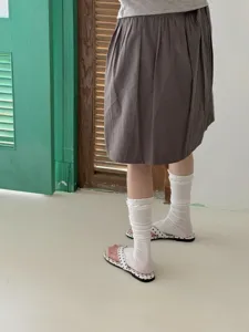 Breathable silk leg warmers for women, thin summer ribbed sock covers with stylish ruffles.