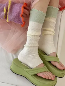Detailed shot of Korean style color-block ruffled leg warmers sock detail, soft breathable knit