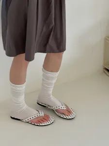 White ruffled leg warmers detail shot, breathable spring thin calf socks styling.