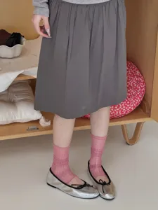 Sheer pink polka dot socks detail shot, soft breathable fabric, stylish daily outfit wear.