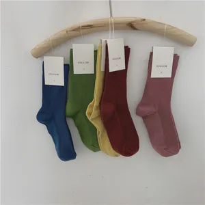 Chaussettes mi-hautes unies côtelées pour femmes, bas en coton de style japonais confortable.