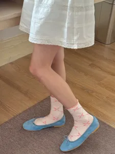 Cute women's mid-tube socks featuring a sweet bow print design, soft breathable casual everyday wear.
