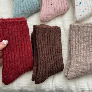 Detail view of thick cashmere wool flecked mid-tube socks, cozy Japanese winter style knitwear.