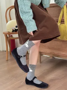 Cozy autumn winter wool blend women crew socks with cute animal pattern and colorful dots style.