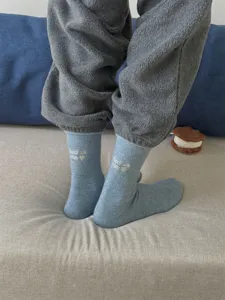 Cozy light blue knit wool socks with sweet embroidery, soft and warm winter wear for women.