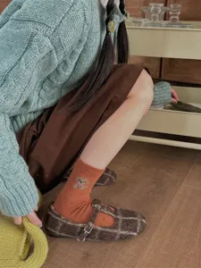 Cute puppy pattern wool mid-tube socks for women, soft cozy winter retro daily wear styling detail.