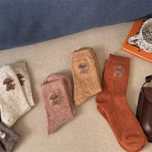 Cute puppy speckled wool women socks, autumn winter soft cozy mid-tube socks, detail view.