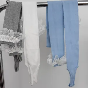 Comfortable knit stirrup leggings with delicate lace ruffles, stylish solid color casual socks.