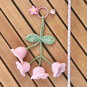 Handcrafted crochet lily of the valley keychain bag charm cute wool floral accessory for car keys.