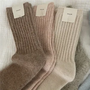 Close up detail view of plush warm ribbed winter socks featuring ultra soft cozy texture.